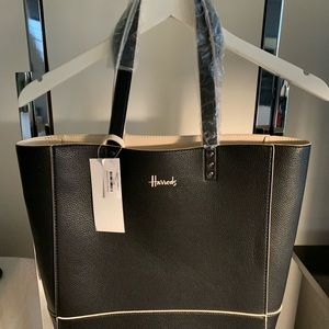 HARRODS Tote Bag from London.  Black with tan inside and the piping is tan.also